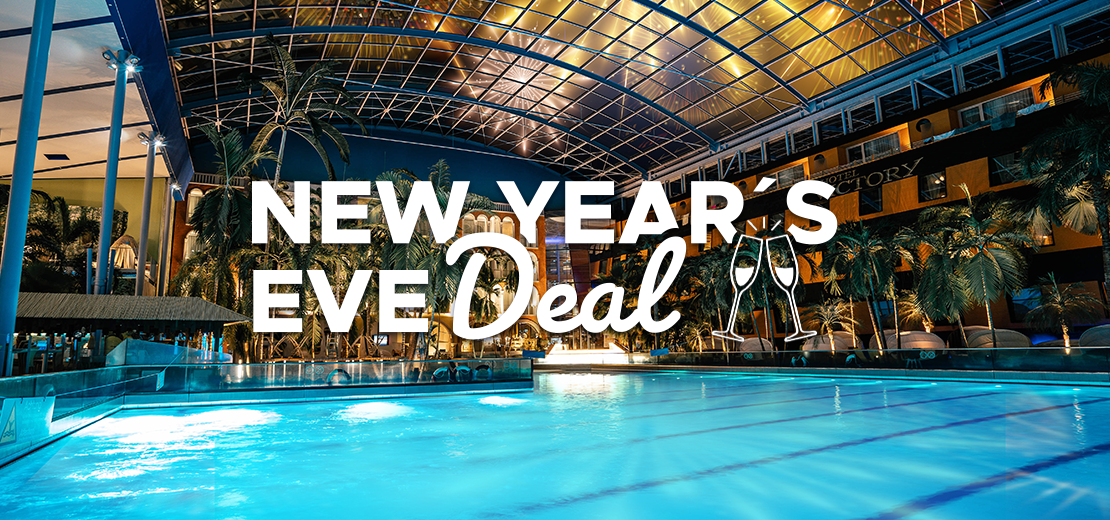 Pool at night, illuminated and fireworks over the roof. Text on picture: New Year's Eve offer