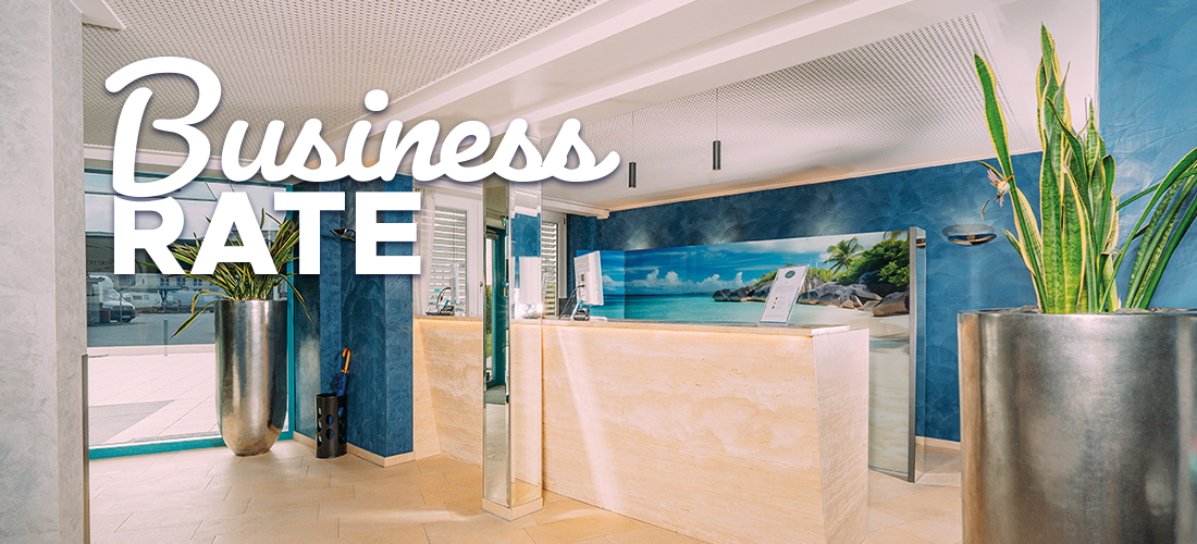 Text on picture: Business Rate. Hotel reception in the background with large plant and bright furnishings